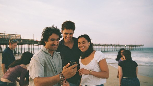 Students on the beach at dusk
