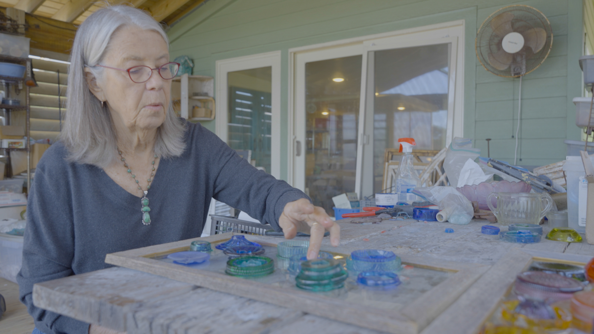Glass is the star of Evansu2019 artwork. She uses slices of glasses and containers.