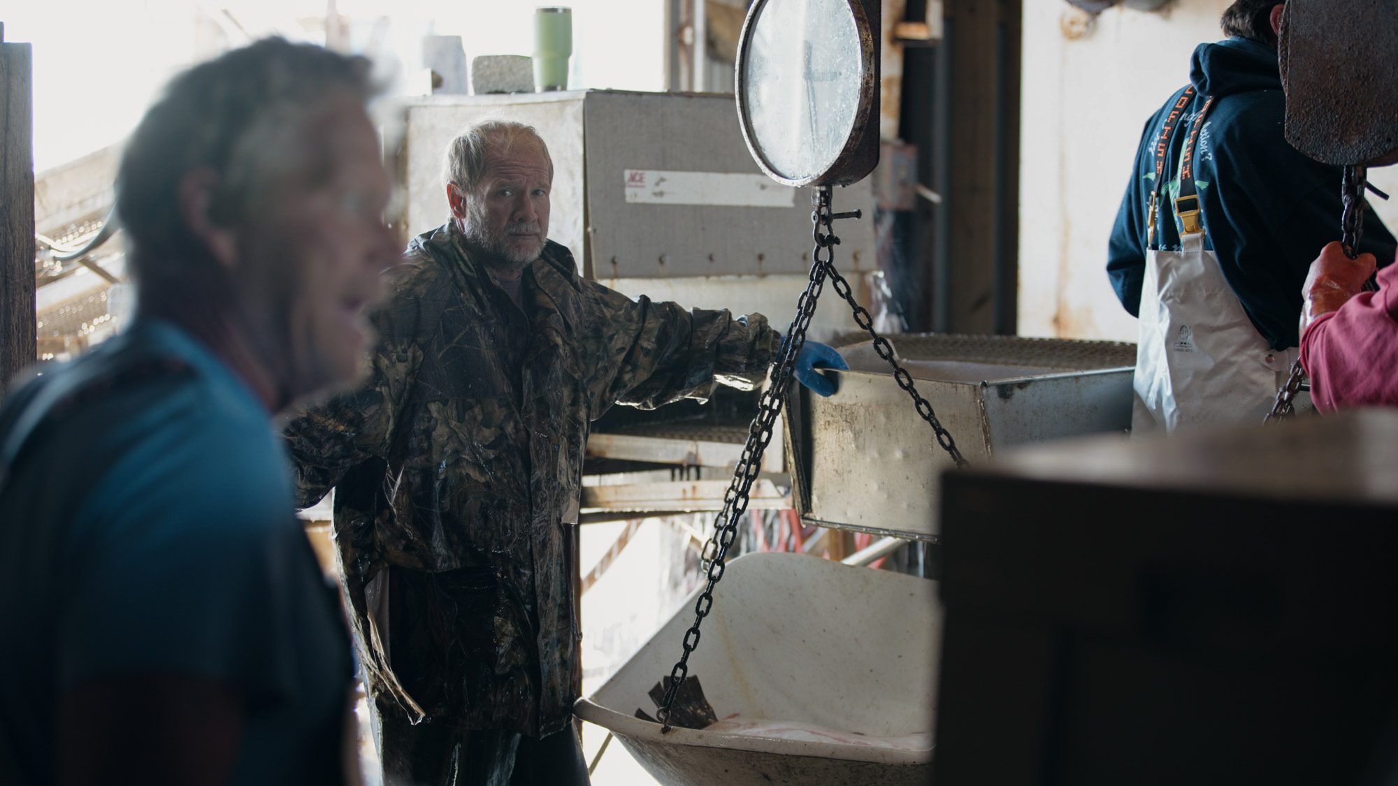 After a boat comes into a fish house, a crew works to unload and ice the fish as soon as possible.
