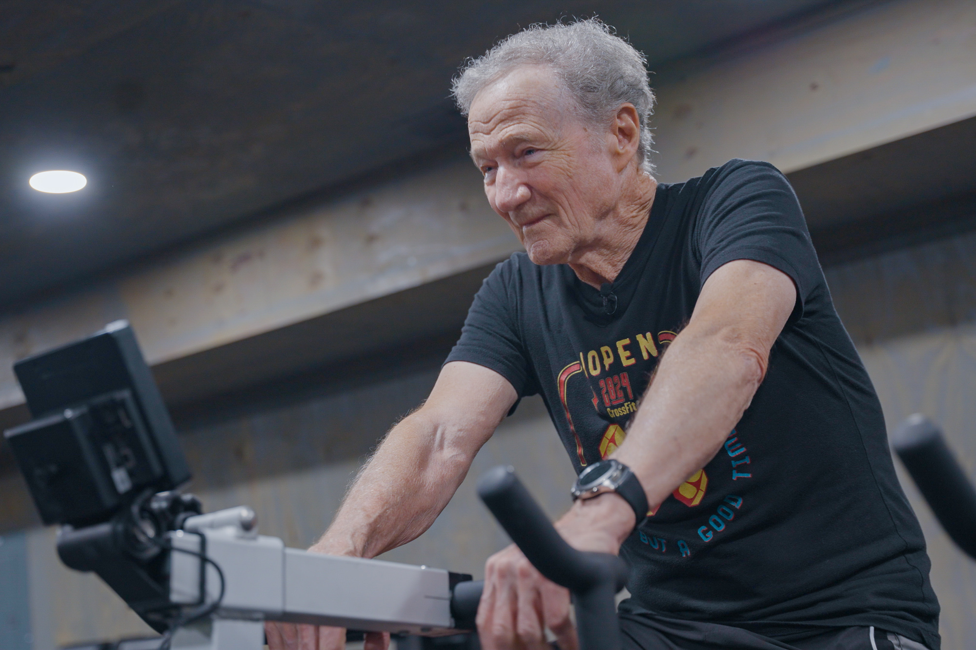 Charlie is cycling on a stationary exercise bike while training at the Roanoke Island Fitness Lab.