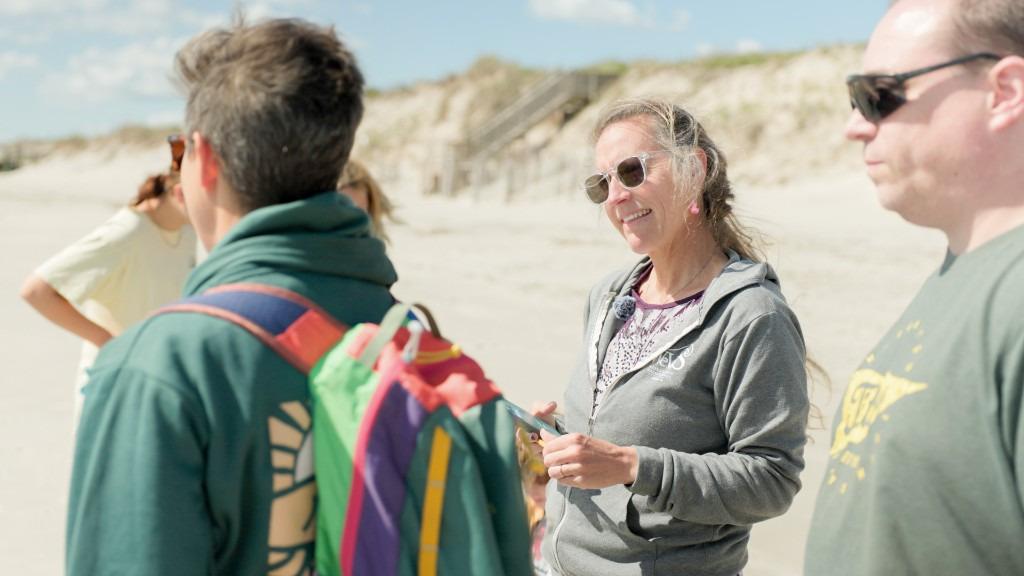 Sylvia Wolff talks to other parents and teachers during a special beach education class. WEVS prides itself on offering unique experiences to its students on the outer banks such as rip current safety, beached whale education and more.