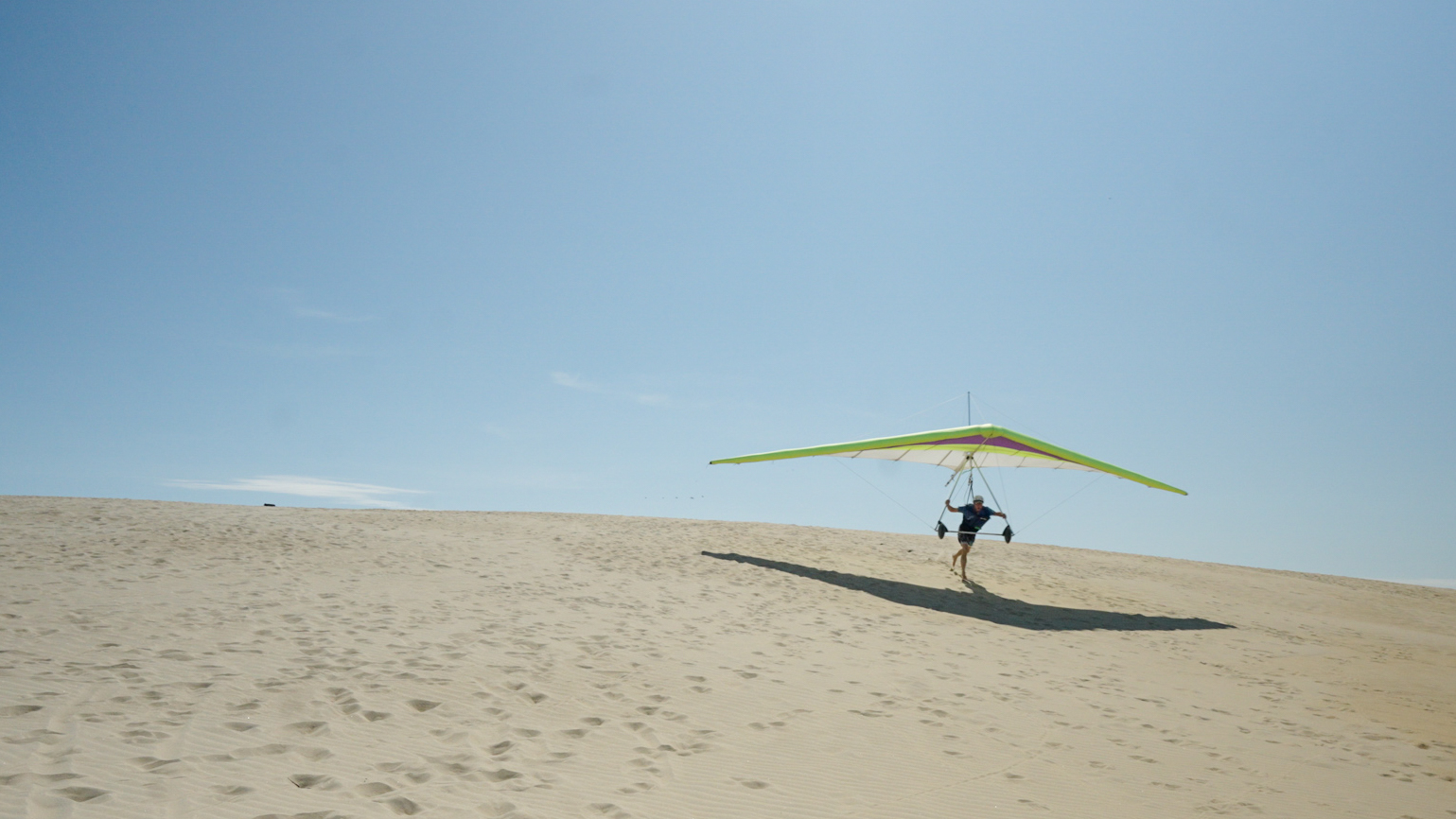 A Competitor takes off for a test flight on the dunes of Jockey's Ridge State Park.