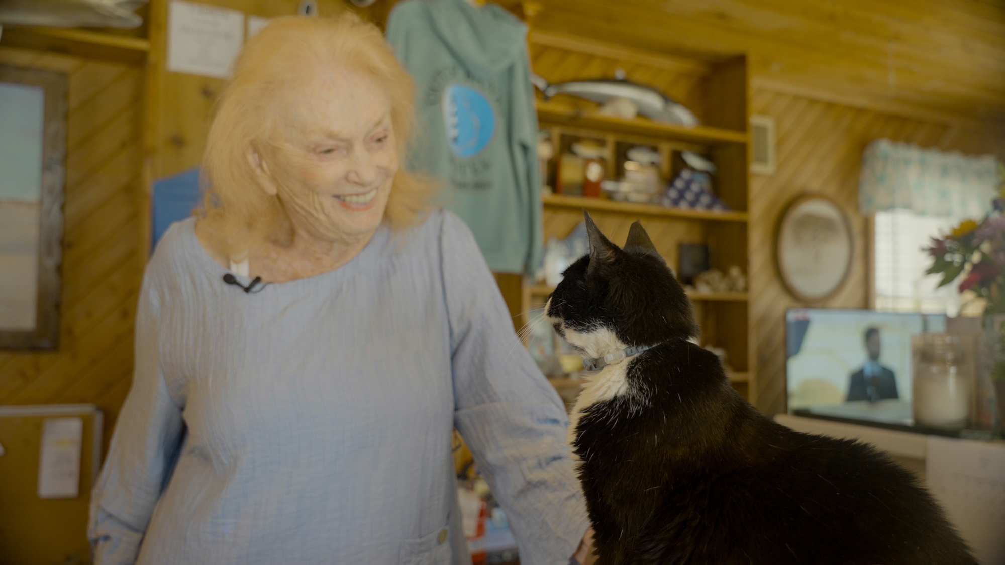 On May 15th, 2026, Carol White Dillon, owner of Outer Banks Motel, speaks lovingly to her pet "Kitty Cat" in the rece…